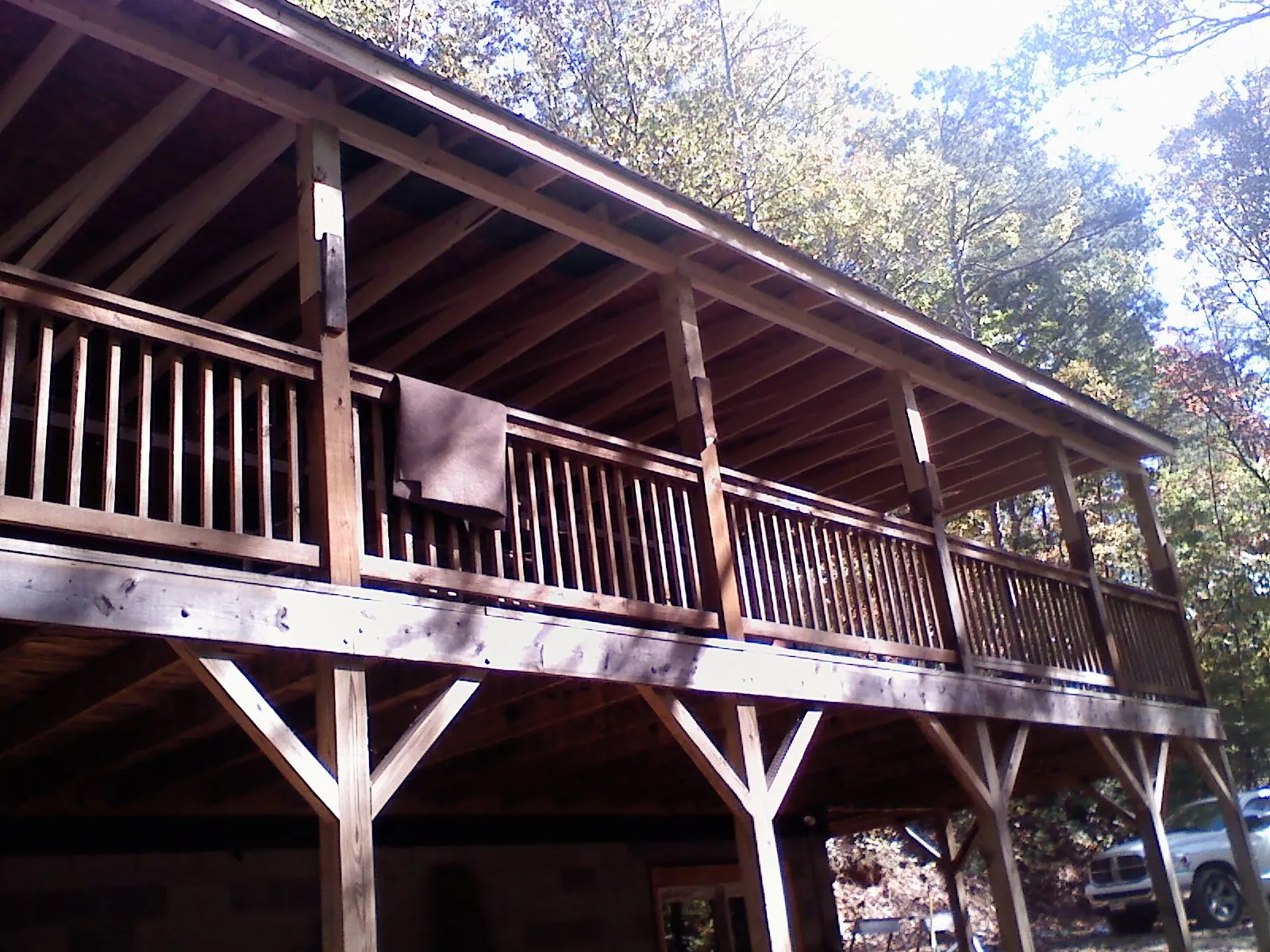 Timber framing under a new elevated porch and deck — Roof Leak Repair in Illinois City by Roofing Brothers